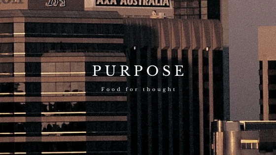 Purpose artwork over a photograph of city buildings