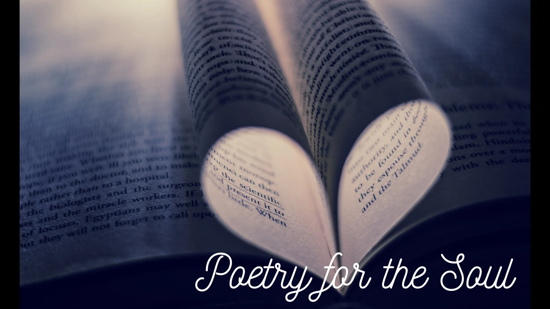 Book pages folded into a heart, with the words Poetry for the Soul